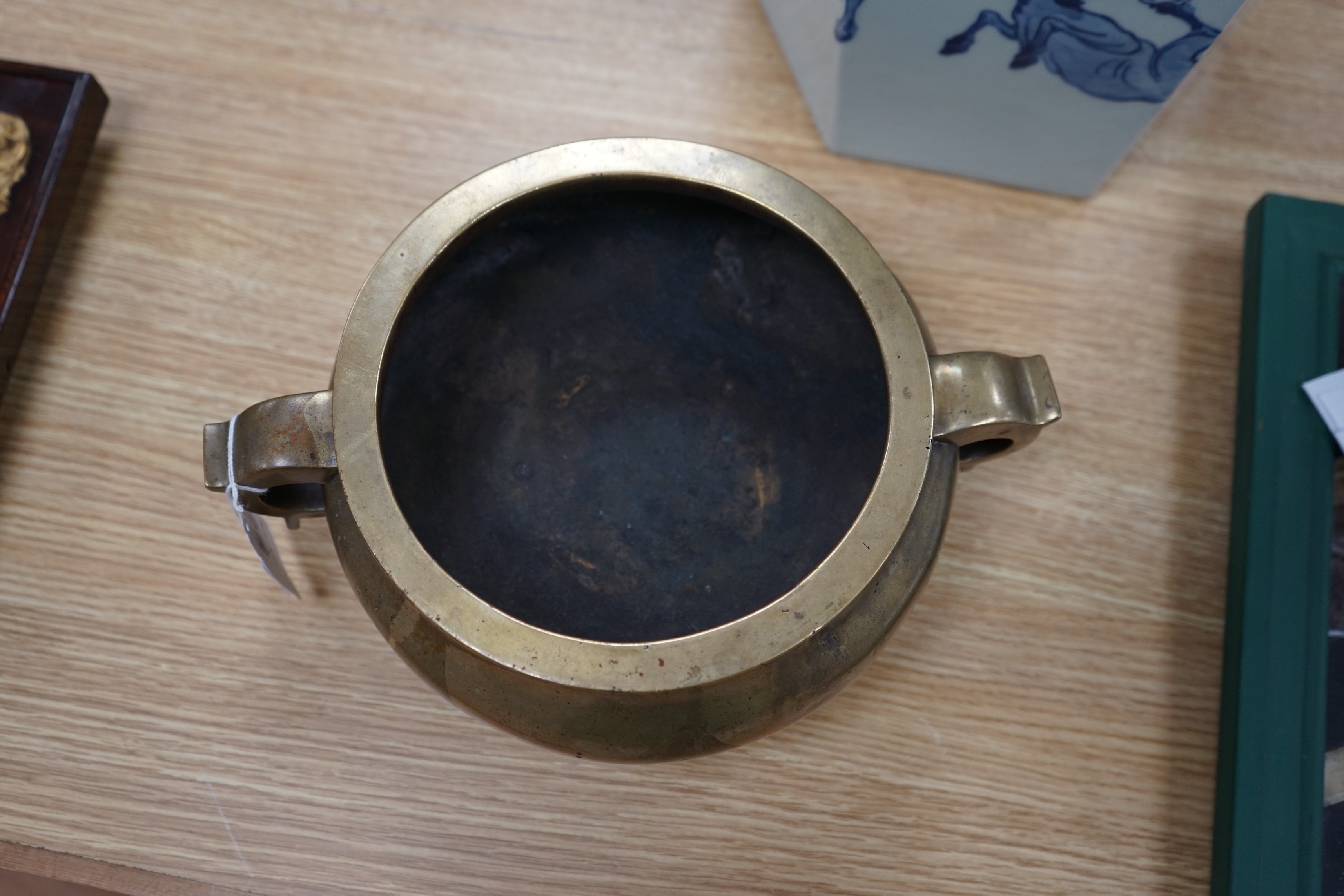 A large Chinese bronze censer, ding, 18th century, with sixteen character Xuande mark, 29cm wide